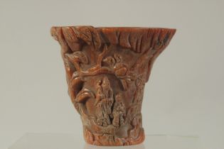 A CHINESE CARVED HORN LIBATION CUP. 4.5ins high.