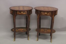 A PAIR OF LOUIS XVI DESIGN OVAL BEDSIDE TABLES. 2ft 5ins high x 1ft 9ins wide.