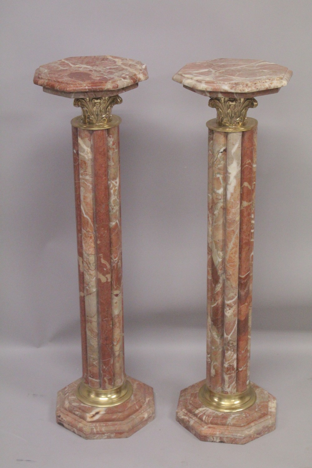 A PAIR OF RED MARBLE CLUSTER COLUMNS with gilt metal mounts. 3ft 4ins high.