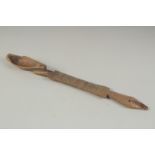 A CARVED WOOD LONG SPOON. 15ins long.