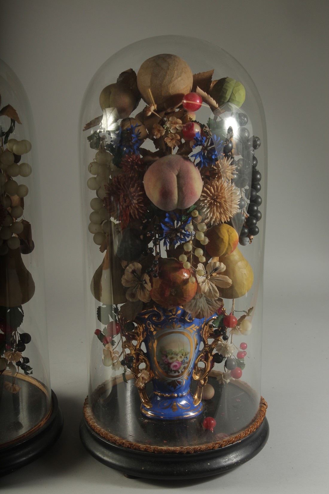 A VERY GOOD PAIR OF VICTORIAN GLASS DOMES, WAX FRUIT in a vase. 23ins overall. - Image 3 of 4