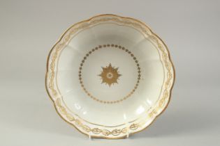 AN 18TH CENTURY DERBY JUNKET DISH decorated with ornate gilding, puce mark, pattern 61.