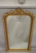 A GOOD LARGE GILT FRAMED VICTORIAN STYLE PIER MIRROR with decorative cresting. 7ft 3ins x 4ft 2ins.