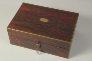 A VERY GOOD VICTORIAN LADIES ROSEWOOD DRESSING CASE with brass banding opening to reveal five silver