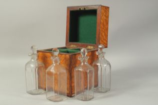 A GOOD LATE REGENCY APPLE WOOD DECORATED BOX AND COVER containing four matching bottles and