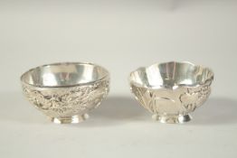 TWO SMALL CHINESE SLIVER CIRCULAR BOWLS. 3ins diameter.