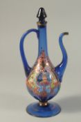 A PERSIAN BLUE GLASS JUG with reverse portraits.