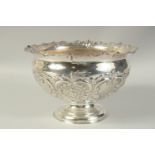 A GOOD CIRCULAR SILVER ROSE BOWL with repousse decoration. 11ins diameter. Sheffield 1926. Maker