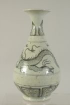 A CHINESE BLUE AND WHITE VASE with dragon and calligraphy. 10ins high.