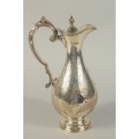 A VICTORIAN SILVER ENGRAVED CLARET JUG. London 1891. Maker: C. B. Weight: 17ozs.