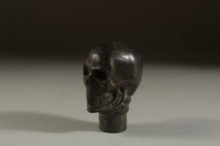 A BRONZE WALKING STICK HANDLE "SKULL". 7cms.