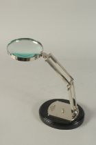 A MAGNIFYING GLASS on a stand.