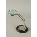 A MAGNIFYING GLASS on a stand.