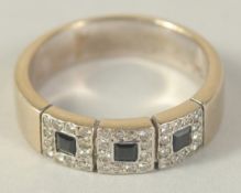 AN 18CT GOLD SAPPHIRE AND DIAMOND BAND RING.