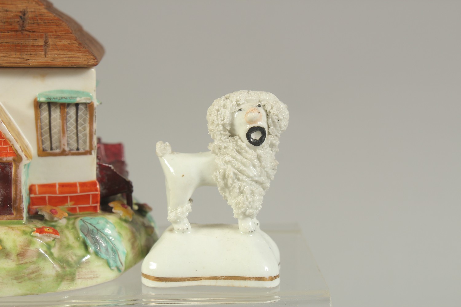 FOUR STAFFORDSHIRE TYPE POODLES, a similar ram and a ceramic cottage with wooden roof. - Image 4 of 7