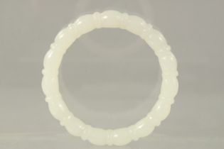 A WHITE JADE RIBBED BANGLE. 8.5cms.