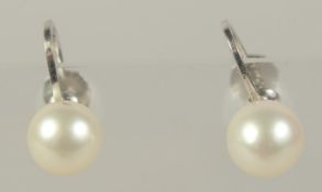 A PAIR OF 9CT WHITE GOLD PEARL EARRINGS.