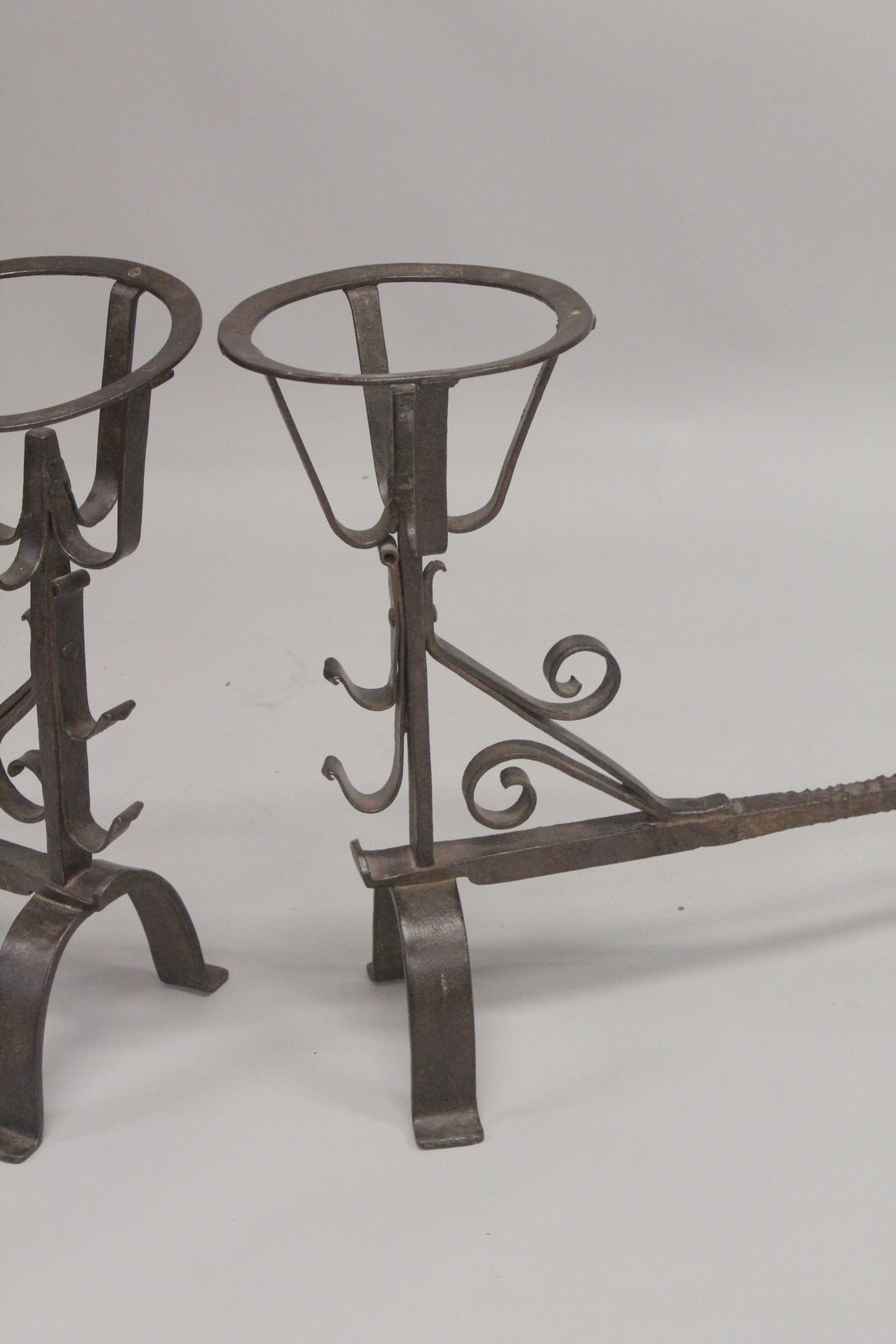 A GOOD PAIR OF EARLY WROUGHT IRON FIRE DOGS. 21ins high, 21ins long, with circle tops. - Image 3 of 3