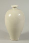 A CHINESE WHITE GLAZED DING WARE MEIPING VASE. 20.5cms high.