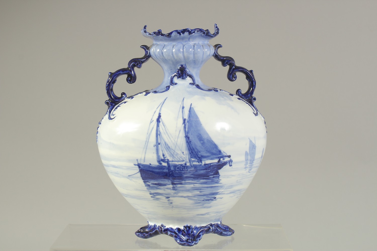 A ROYAL CROWN DERBY TWO-HANDLED VASE, painted with sailing vessels in blue, by WEJ Dean, date mark