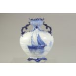 A ROYAL CROWN DERBY TWO-HANDLED VASE, painted with sailing vessels in blue, by WEJ Dean, date mark