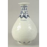 A CHINESE BLUE AND WHITE CARVED FLORAL YUHUCHUNPIN VASE. 32cms high.