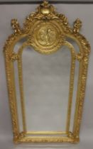 A VERY GOOD LOUIS XVITH DESIGN GILTWOOD MIRROR with cupids, scrolls etc. 7ft high x 2ft 6ins wide.