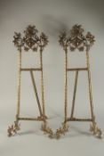 A LARGE PAIR OF BRONZE EASELS. 32ins high.