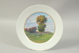 A MEISSEN PLATE with trees in a landscape, in the Art Nouveau style. Circa. 1910. 27cm diameter.