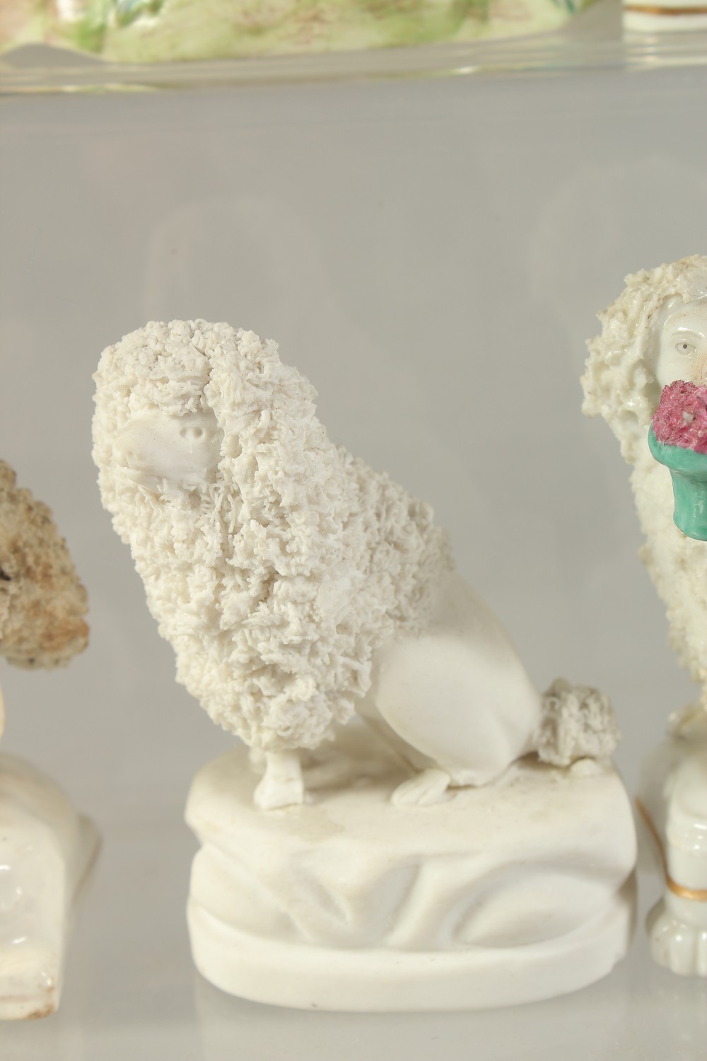 FOUR STAFFORDSHIRE TYPE POODLES, a similar ram and a ceramic cottage with wooden roof. - Image 6 of 7