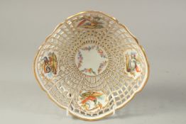 A BERLIN PIERCED WORK BASKET, with five painted panels, four with exotic birds and a fifth with