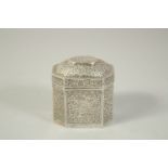 A SMALL BURMESE SILVER TEA CADDY AND COVER. 3ins high.