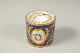 A COALPORT DRUM INKWELL, painted front and back with a bouquet of flowers, in a gilt oval panel,