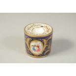 A COALPORT DRUM INKWELL, painted front and back with a bouquet of flowers, in a gilt oval panel,