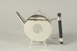 A CHRISTOPHER DRESSER DESIGN PLATED TEAPOT, circle with a hole.