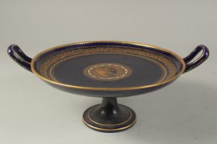 A COMMEMORATIVE TAZZA OR COMPORT, with deep blue ground, having a central gilt cicular panel with