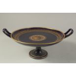 A COMMEMORATIVE TAZZA OR COMPORT, with deep blue ground, having a central gilt cicular panel with