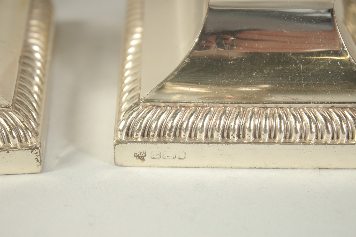 A GOOD PAIR OF TWO BRANCH SILVER CANDLESTICKS with coloums on square bases. 12ins high. London - Image 6 of 6