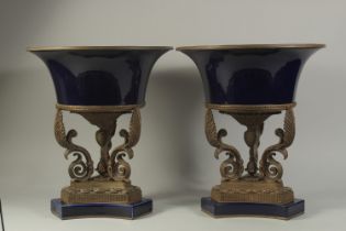 A GOOD PAIR OF LARGE SEVRES DESIGN BLUE PORCELAIN AND ORMOLU URNS, with pineapple and scrolling