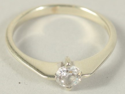 A 9CT GOLD CUBIC ZIRCONIA SINGLE STONE RING.