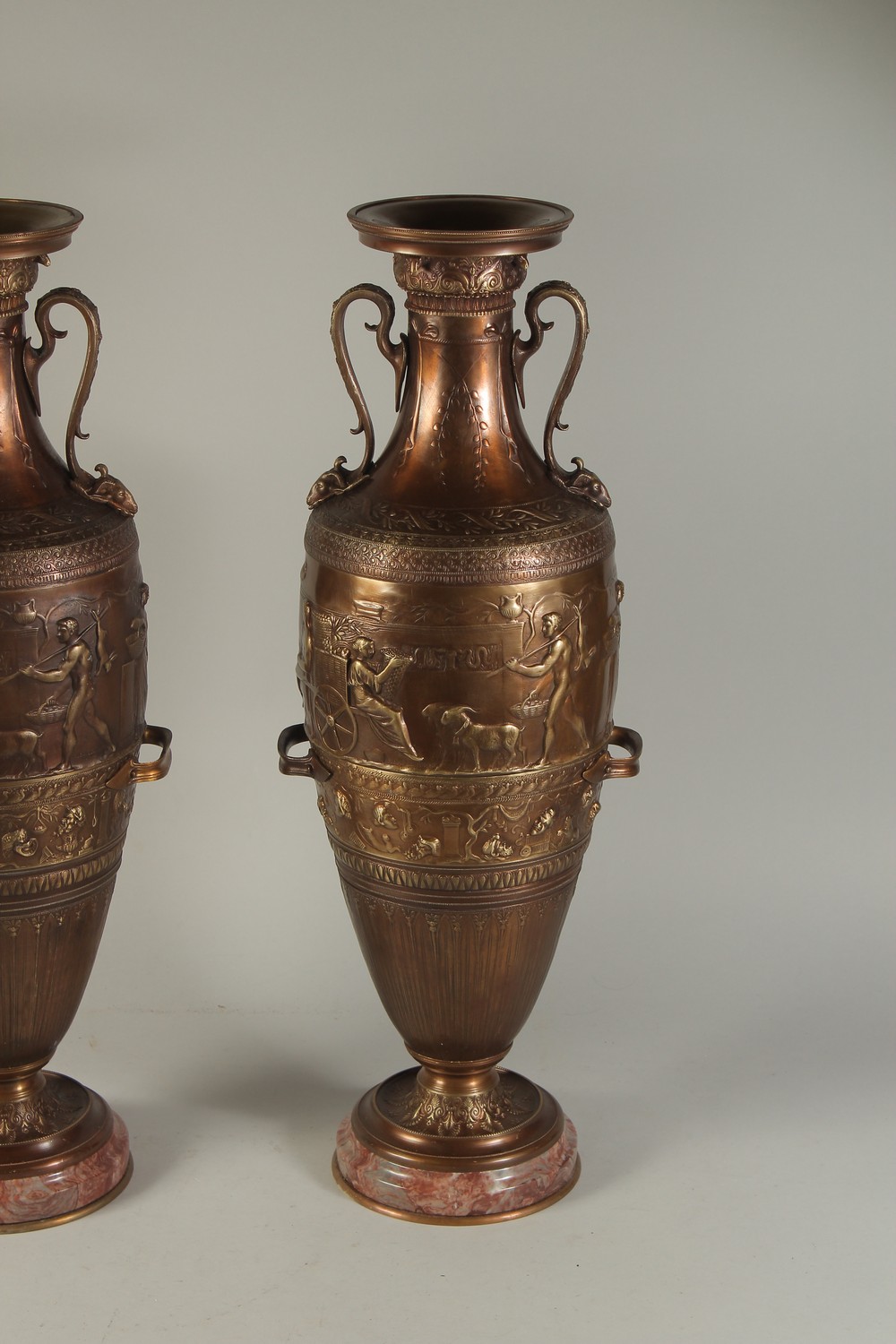 A SUPERB PAIR OF TWO-HANDLED CLASSICAL BRONZE URNS decorated with panels of classical figures. - Image 3 of 4