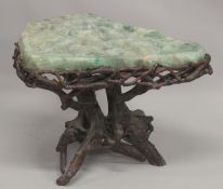 A SUPERB MARBLE TOP TABLE with rustic base. 2ft 4ins long, 1ft 10ins wide at the longest point.