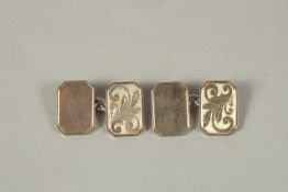 A PAIR OF SILVER CUFF LINKS.
