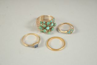 A 22CT GOLD WEDDING BAND AND THREE VARIOUS RINGS (4).