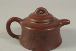 A CHINESE YIXING TEAPOT, with impressed mark to inner lid and base.