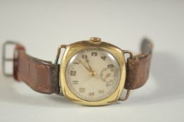 A GENTLEMAN'S WRIST WATCH, CIRCA. 1930, with a gold fitlled case and leather strap.