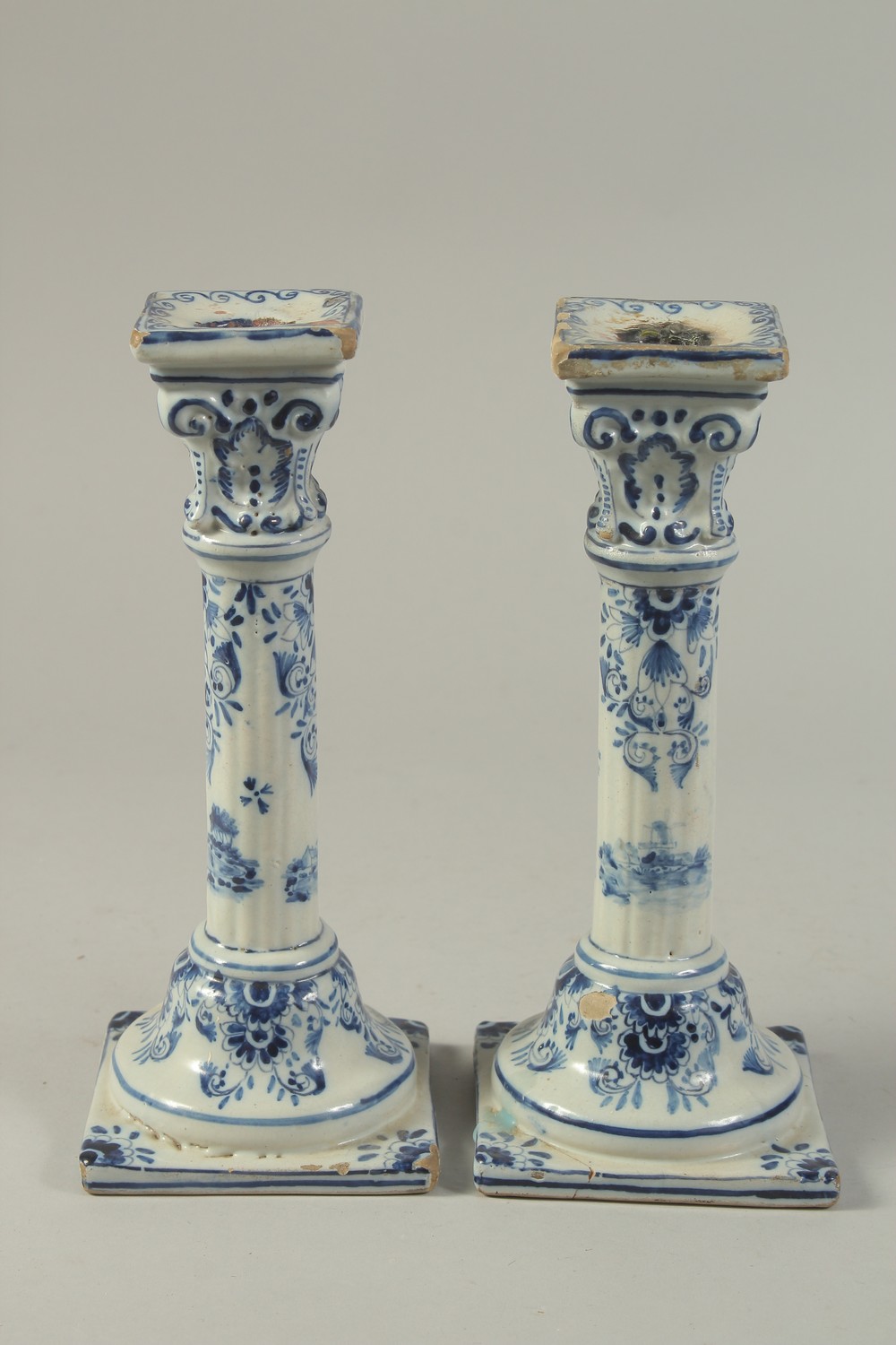 A PAIR OF DUTCH BLUE AND WHITE CANDLESTICKS on square bases. 10ins high. - Image 4 of 6