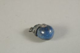 A SILVER AND LAPIS SNAKE EGG PENDANT. 2.5cms. 4.6gms.