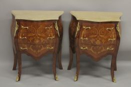 A PAIR OF LOUIS XVI DESIGN INLAID SERPENTINE FRONTED MARBLE TOP COMMODES with three drawers, on