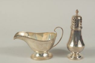 A SILVER SAUCEBOAT. Sheffield, 1931, and a SUGAR SIFTER, Birmingham, 1901/02.